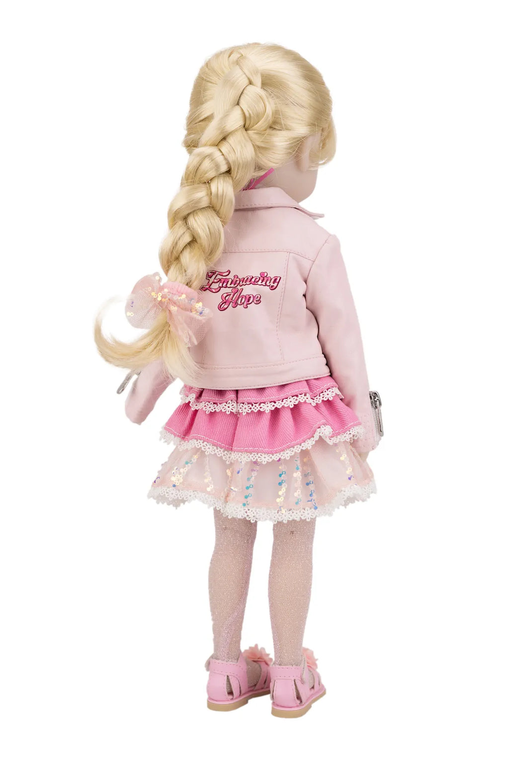 Karina wearing a pink outfit on a white background