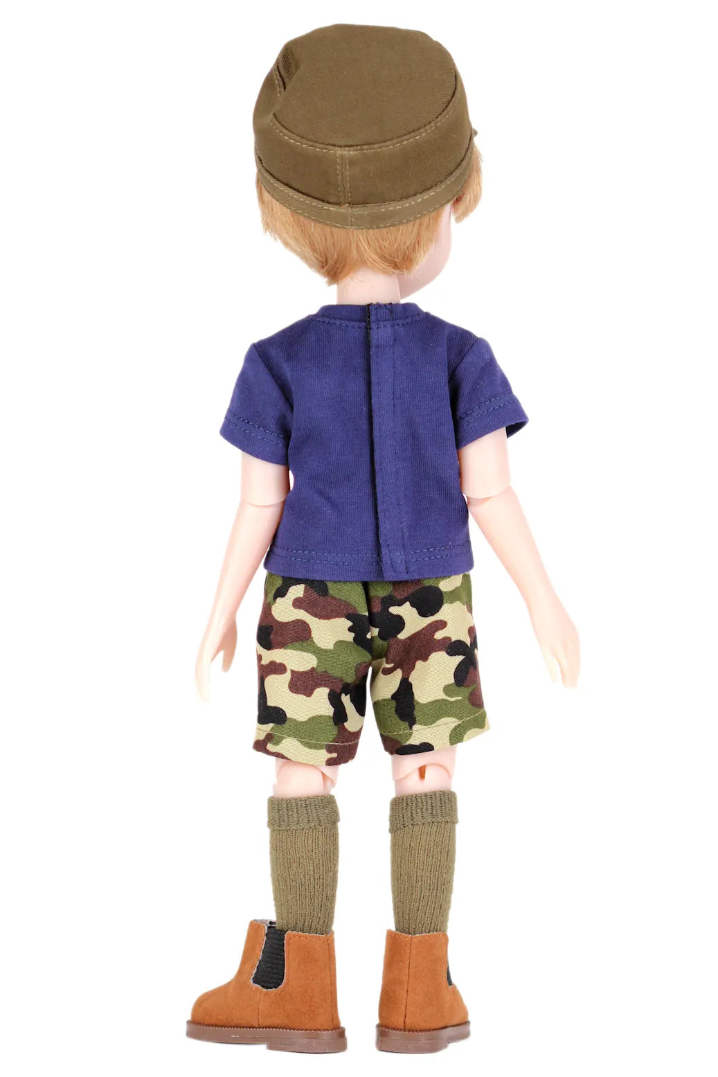 Rory wearing a blue shirt, camouflage shorts, and brown boots on a white background