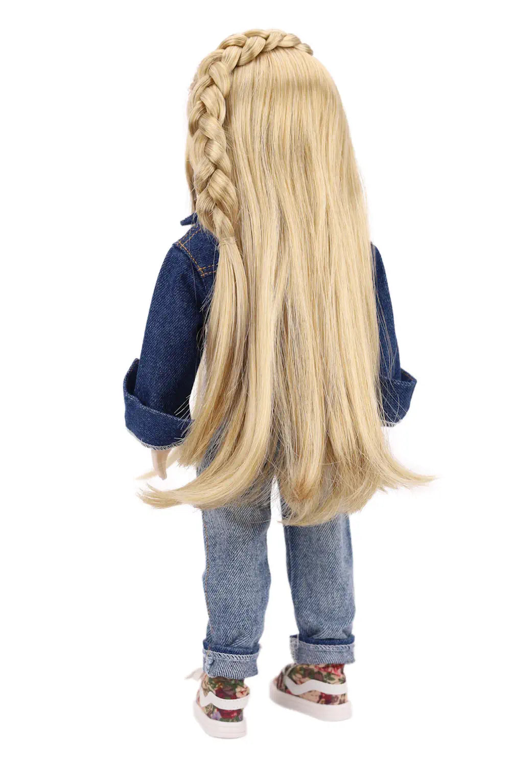Doll with long blonde hair styled in braids, wearing a denim outfit on a white background