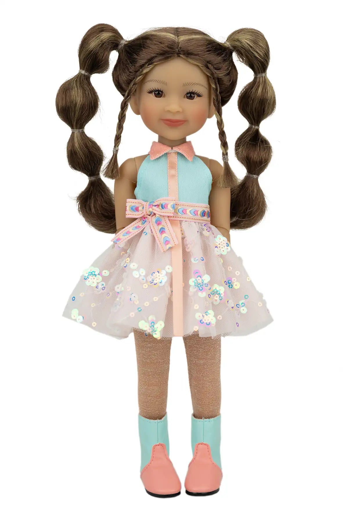Abby with pigtails wearing a light blue dress with floral patterns on a white background