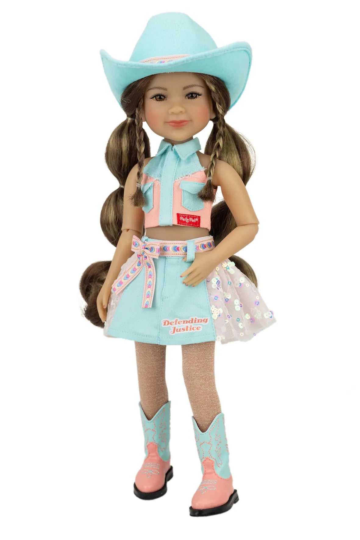Amina in a turquoise cowboy outfit with a matching hat on a white background