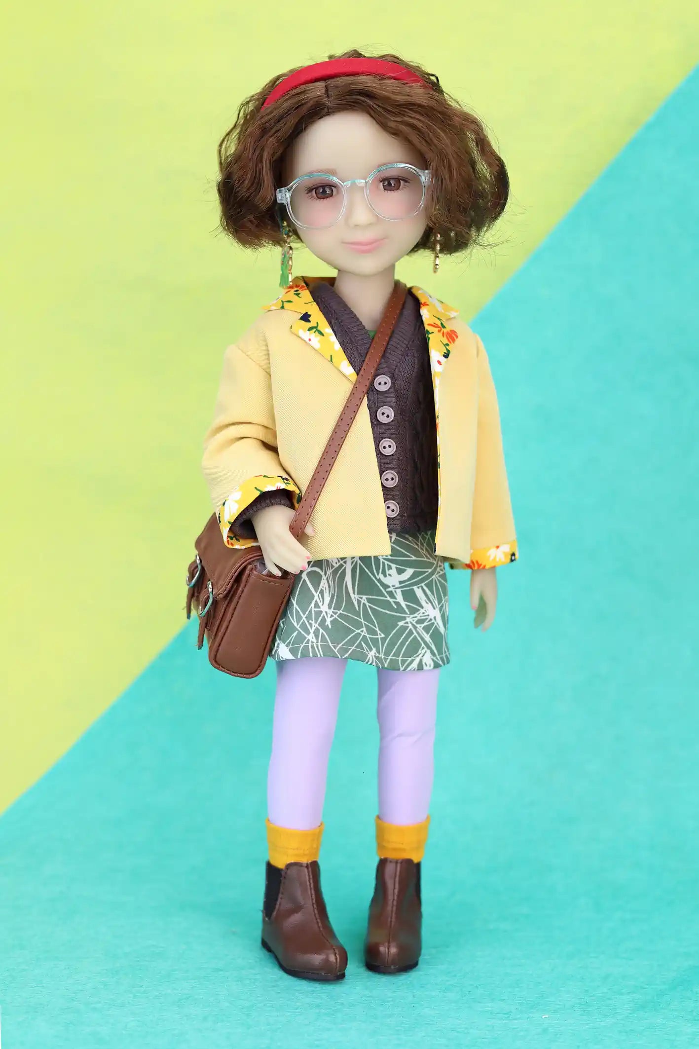 Ava wearing a yellow jacket, green skirt, and purple leggings on a colorful background