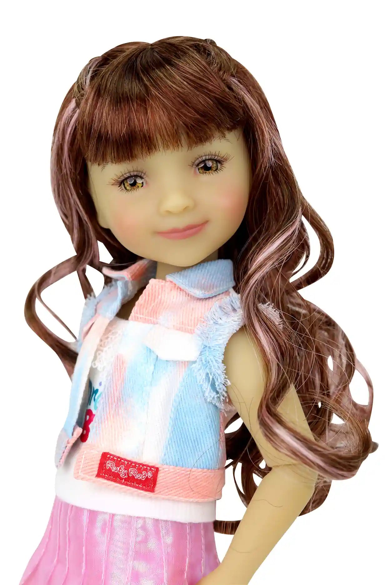 Bella, long wavy brown hair with pink highlights, wearing white tank, sleeveless jacket and shiny pink skirt, white background.