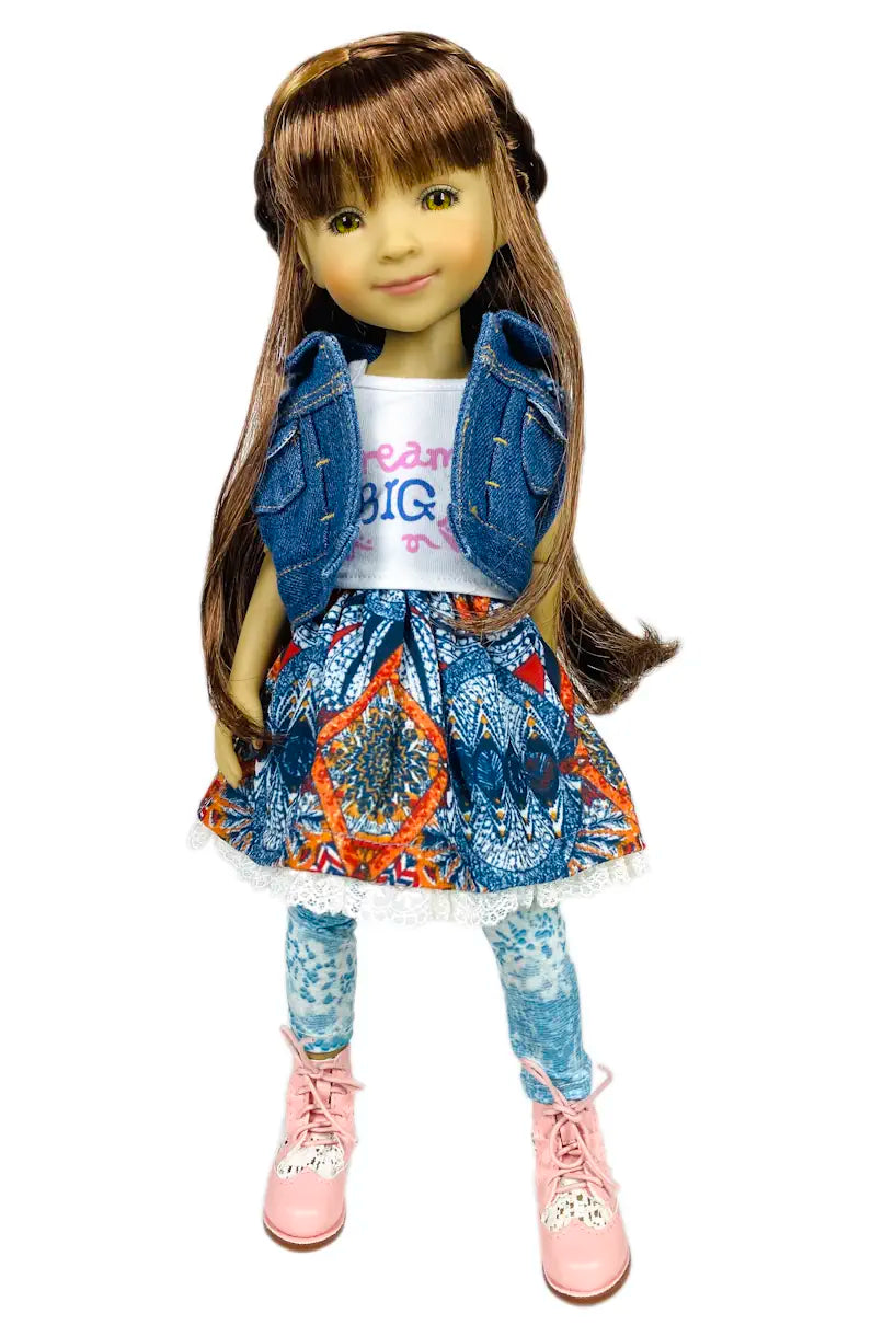 Bella wearing a denim jacket, colorful skirt, and pink shoes on a white background