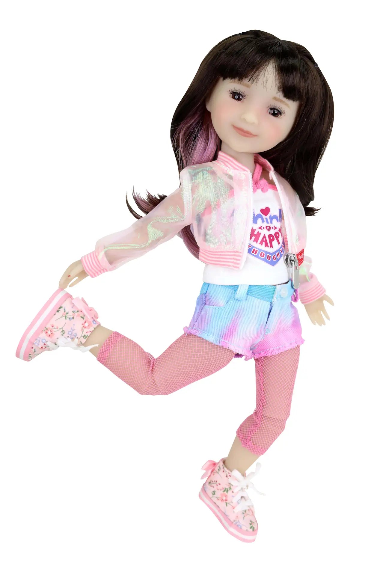 Hanna jumps with one leg raised in a sheer jacket, white tank, tie-dye shorts,  fishnet tights, and floral sneakers.