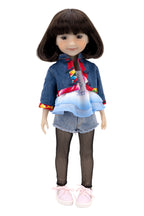 Hanna wearing a denim outfit with a white background