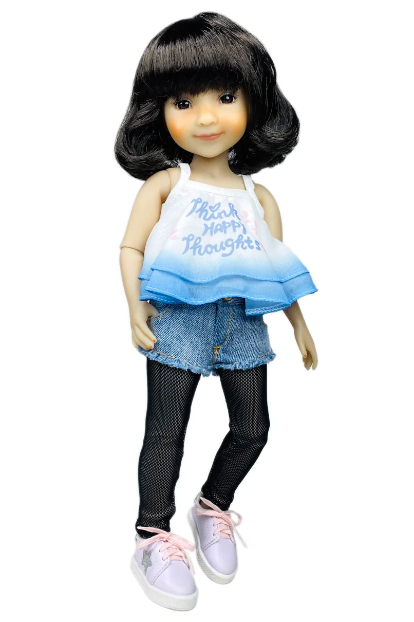 Hanna wearing a blue and white top with text, denim shorts, and pink shoes on a white background