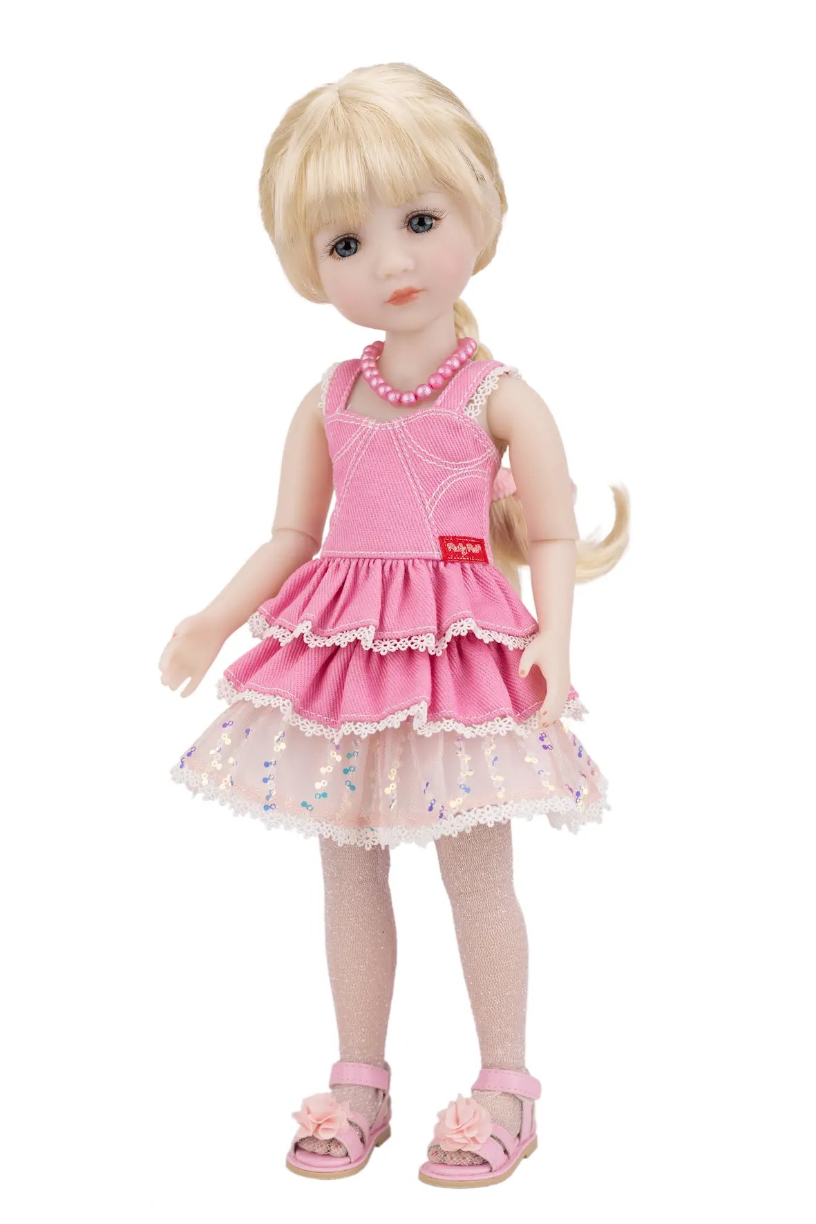 Karina wearing a pink dress with a white background