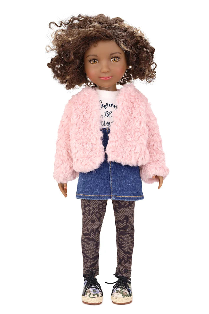 Maya wearing a pink jacket, denim skirt, and patterned leggings on a white background