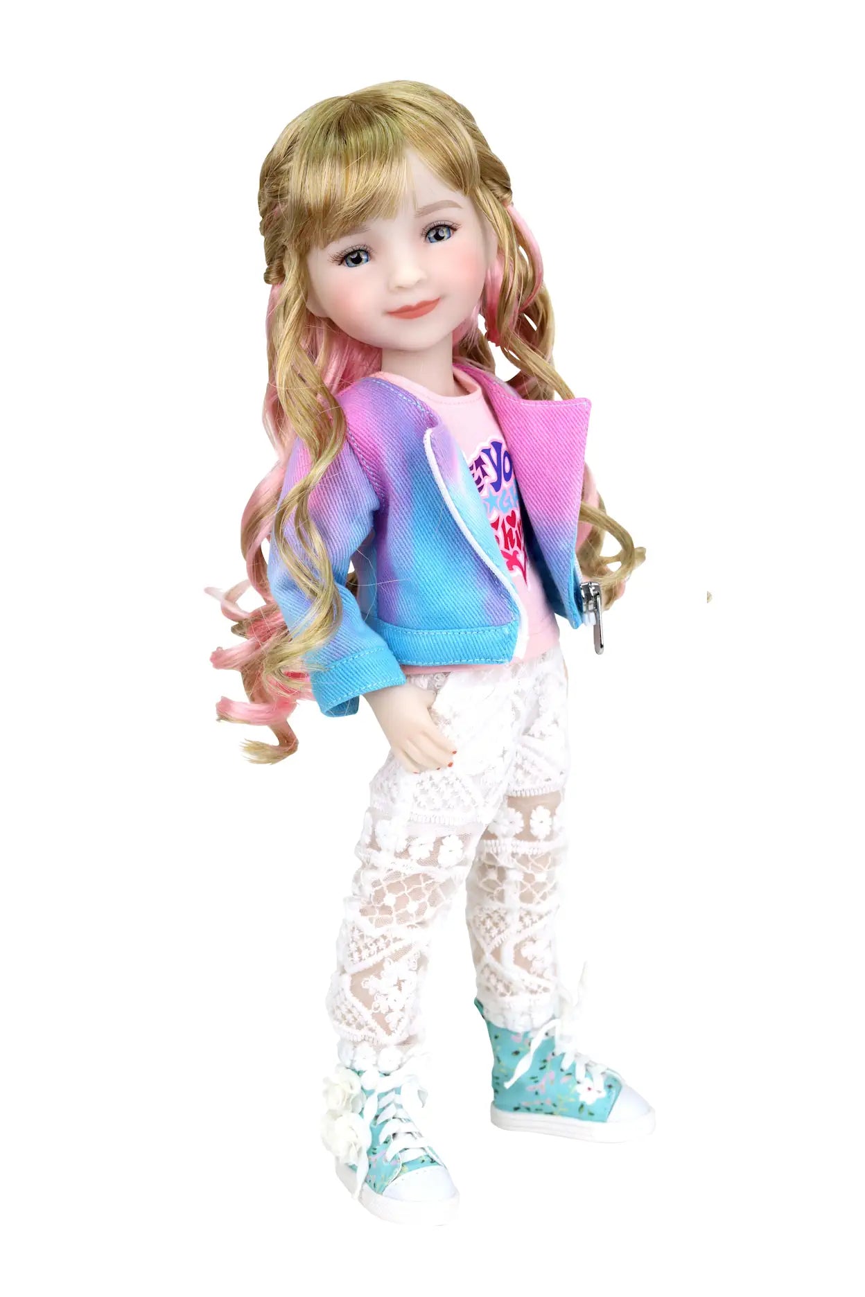 Sara, blonde hair with pink highlights, in pink T-shirt, tie-dye jacket, lace pants, hand in pocket, white background.