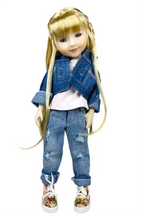Sara wearing a denim outfit with a white background