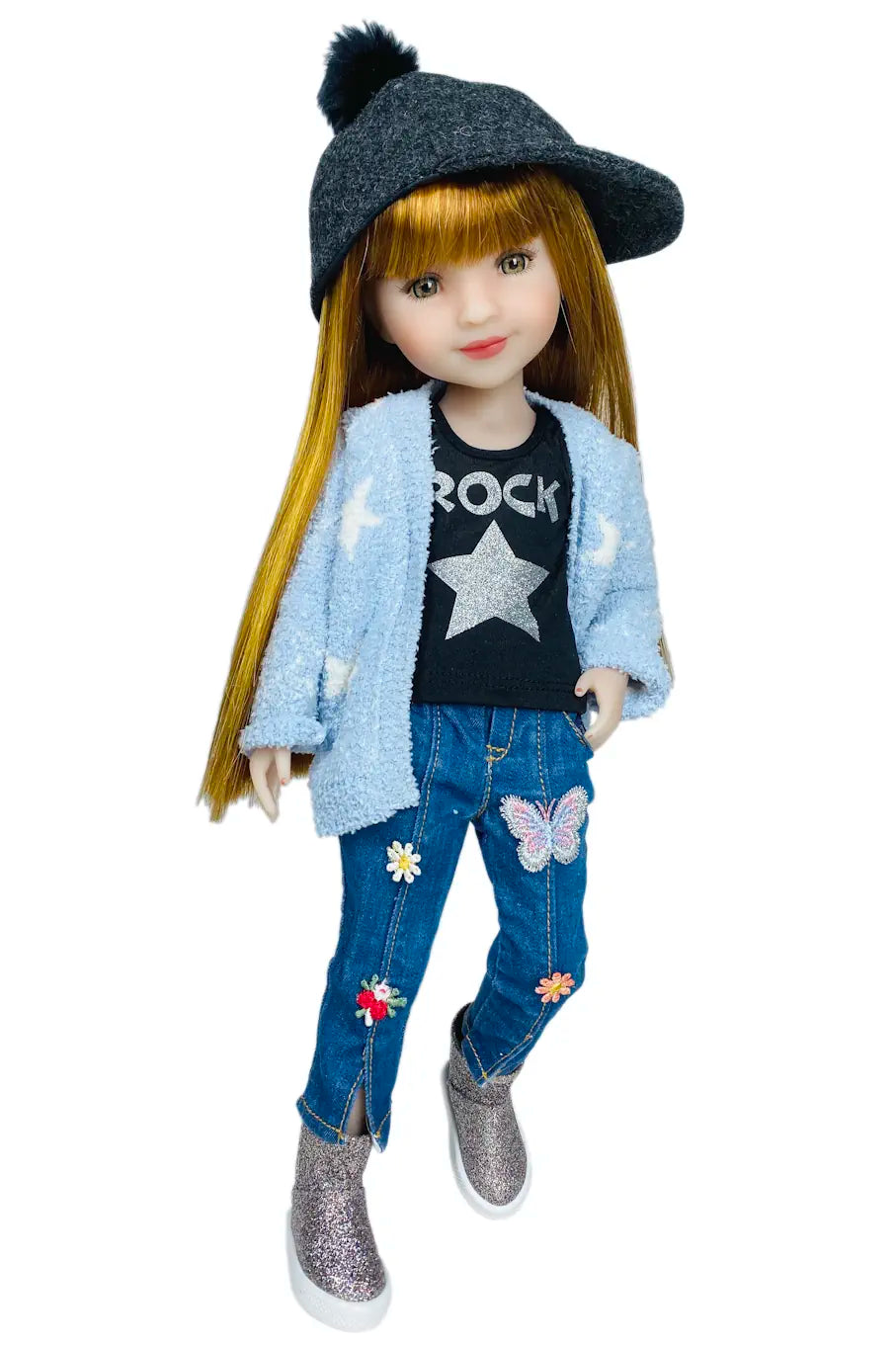 Stella wearing a blue cardigan, black t-shirt with 'ROCK' and star design, blue jeans with floral and butterfly patches, and gray shoes on a white background.