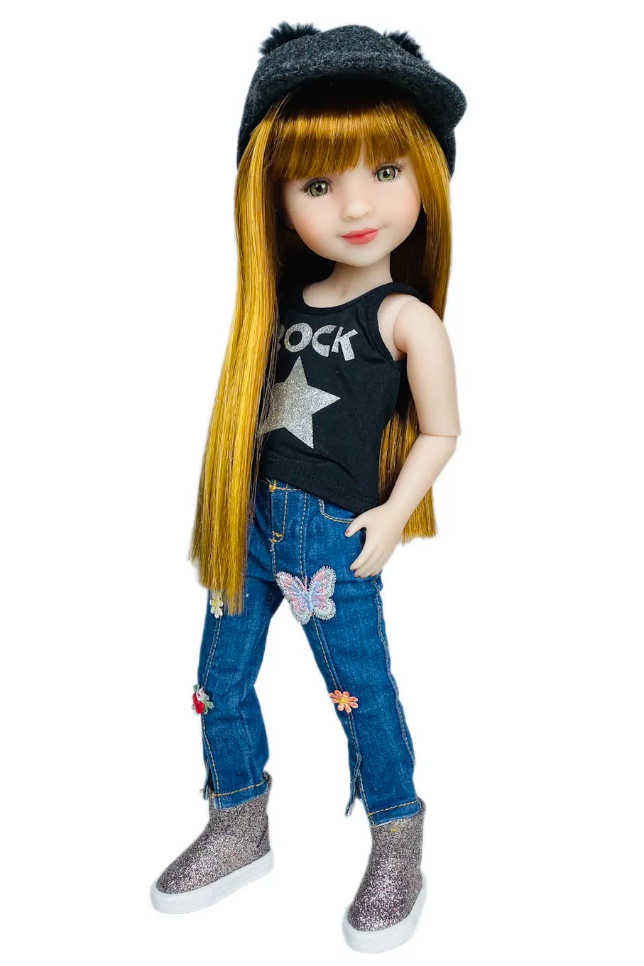 Stella wearing a black tank top with a star, blue jeans with patches, and gray shoes on a white background