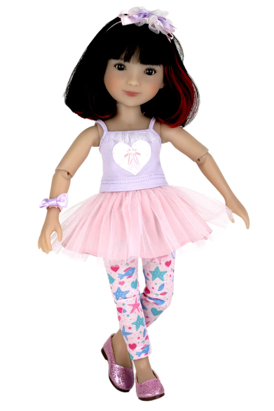 Sydney wearing a pink outfit with a heart design on a white background