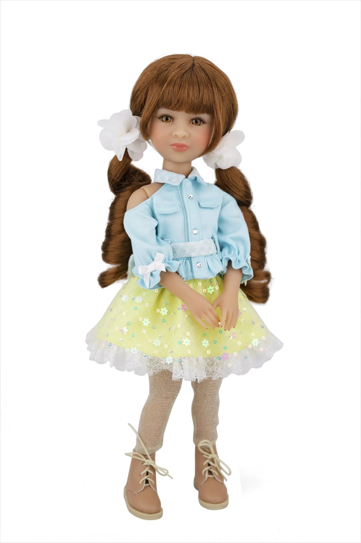 Valeria with brown hair styled in pigtails, wearing a light blue jacket, yellow dress with white flowers, and beige boots on a white background.