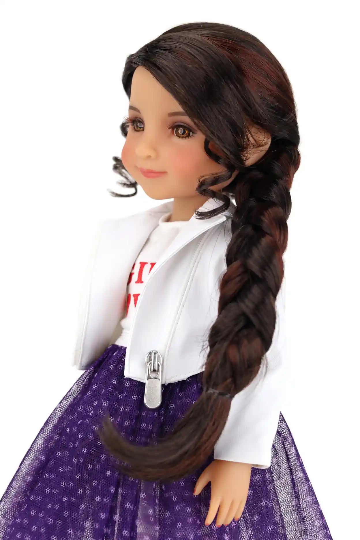 Freida with long braided hair wearing a white jacket and purple dress on a white background