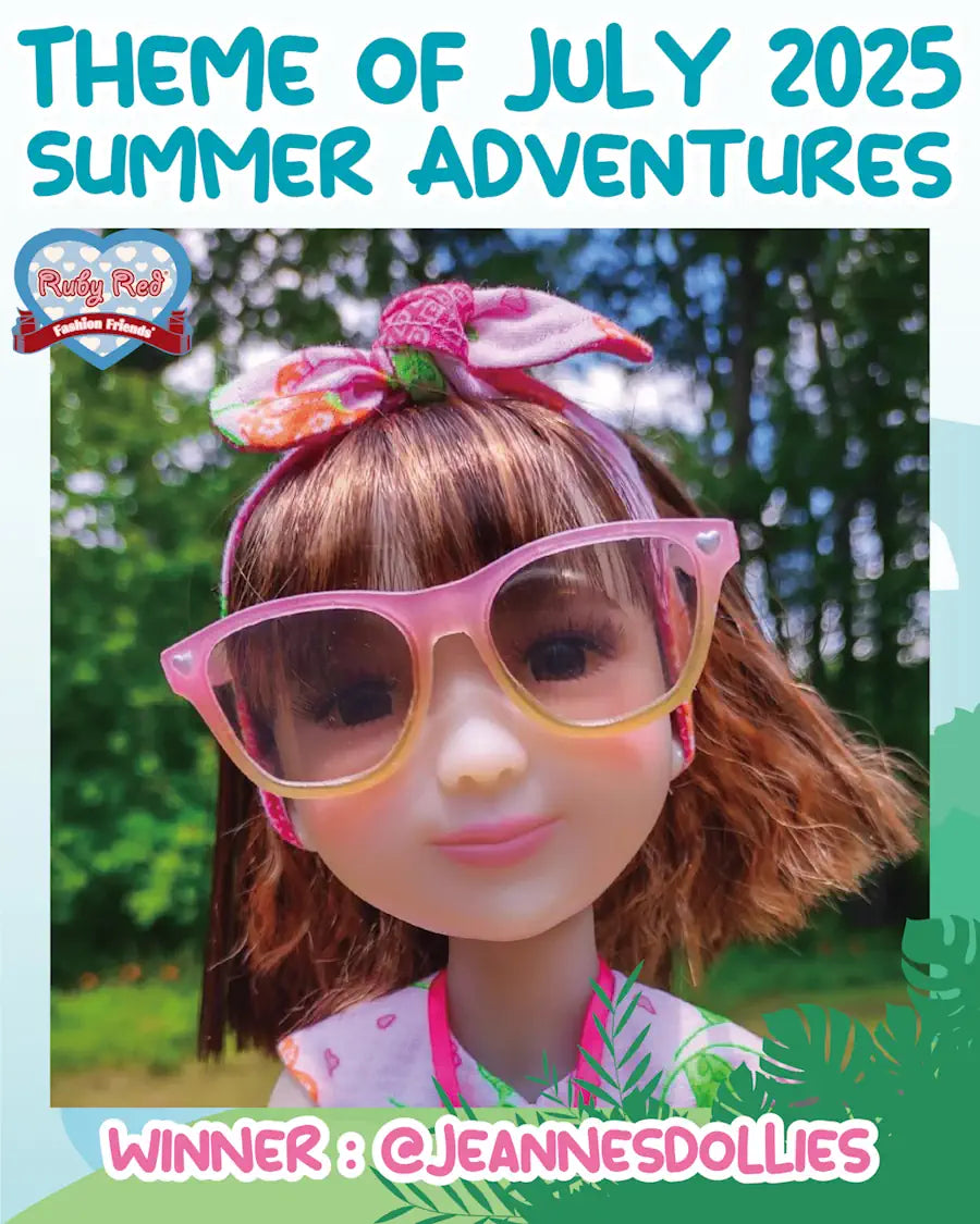 Doll with pink sunglasses and colorful headband against a natural background, with text about July 2025 theme winner@jeannesdollies