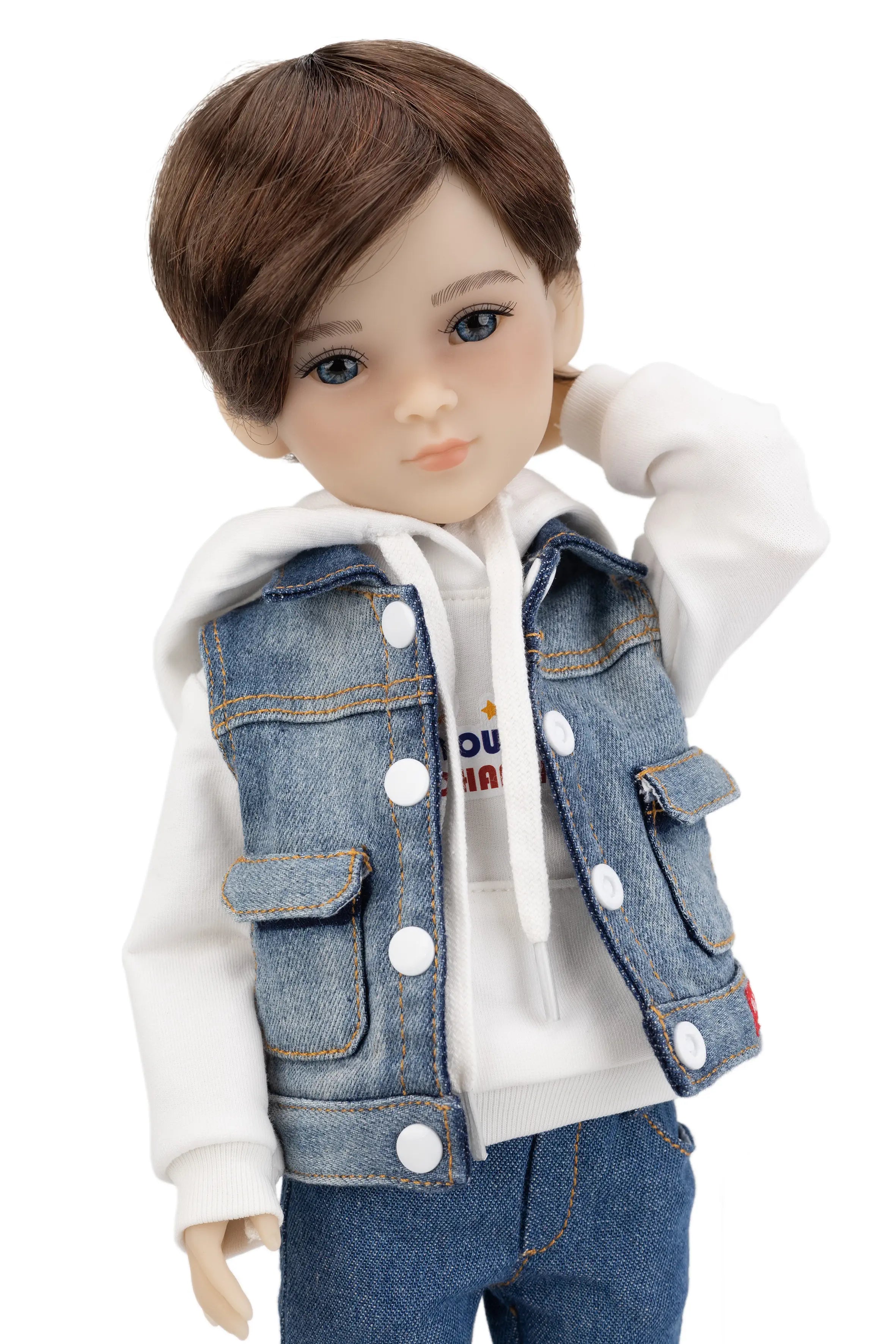Doll wearing a denim vest over a white hoodie on a white background