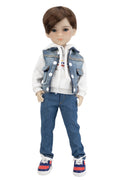 Doll wearing a denim vest, white hoodie, blue jeans, and colorful sneakers on a white background