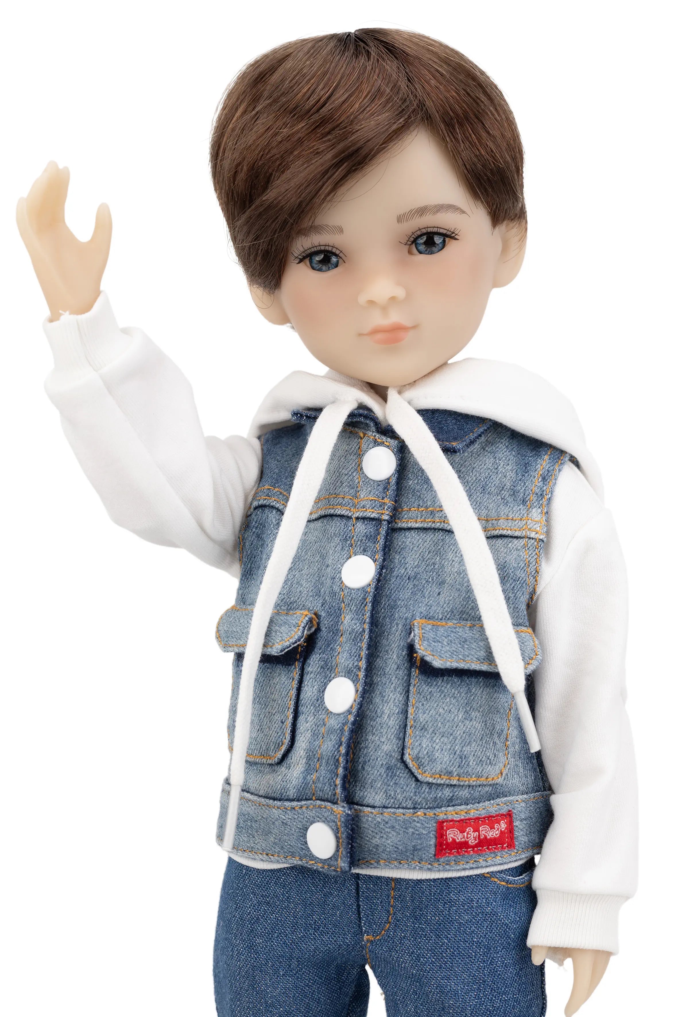 Doll wearing a denim vest and white shirt on a white background