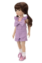 Doll wearing a purple outfit with a large bow on a white background