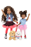 Two dolls with curly hair, one holding a teddy bear and the other a dog, on a white background.