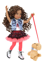 Doll with long brown hair wearing a denim vest, red skirt, and pink tights, holding a red leash with a teddy bear toy.