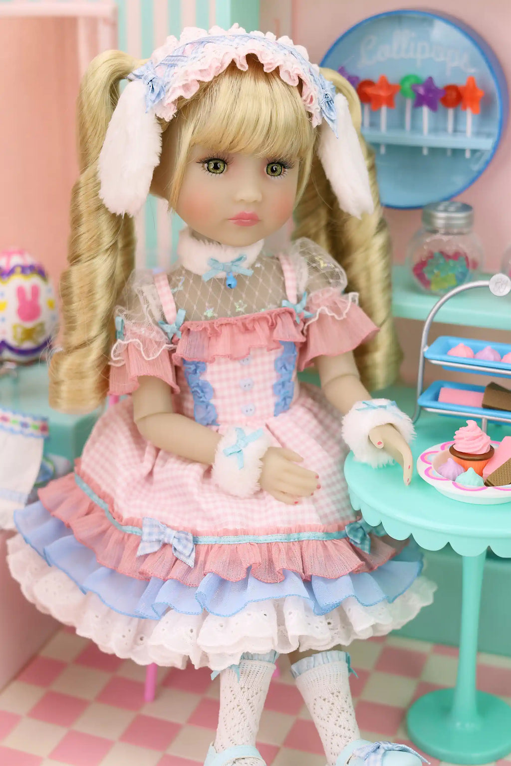 Doll in a pink and blue dress with a checkered floor and toy store background