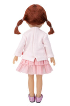 Doll with a pink outfit on a white background