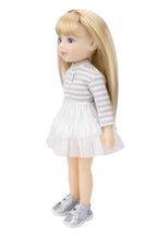 Doll with blonde hair wearing a striped dress on a white background