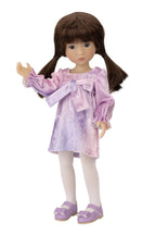 Doll wearing a purple dress with a bow on a white background