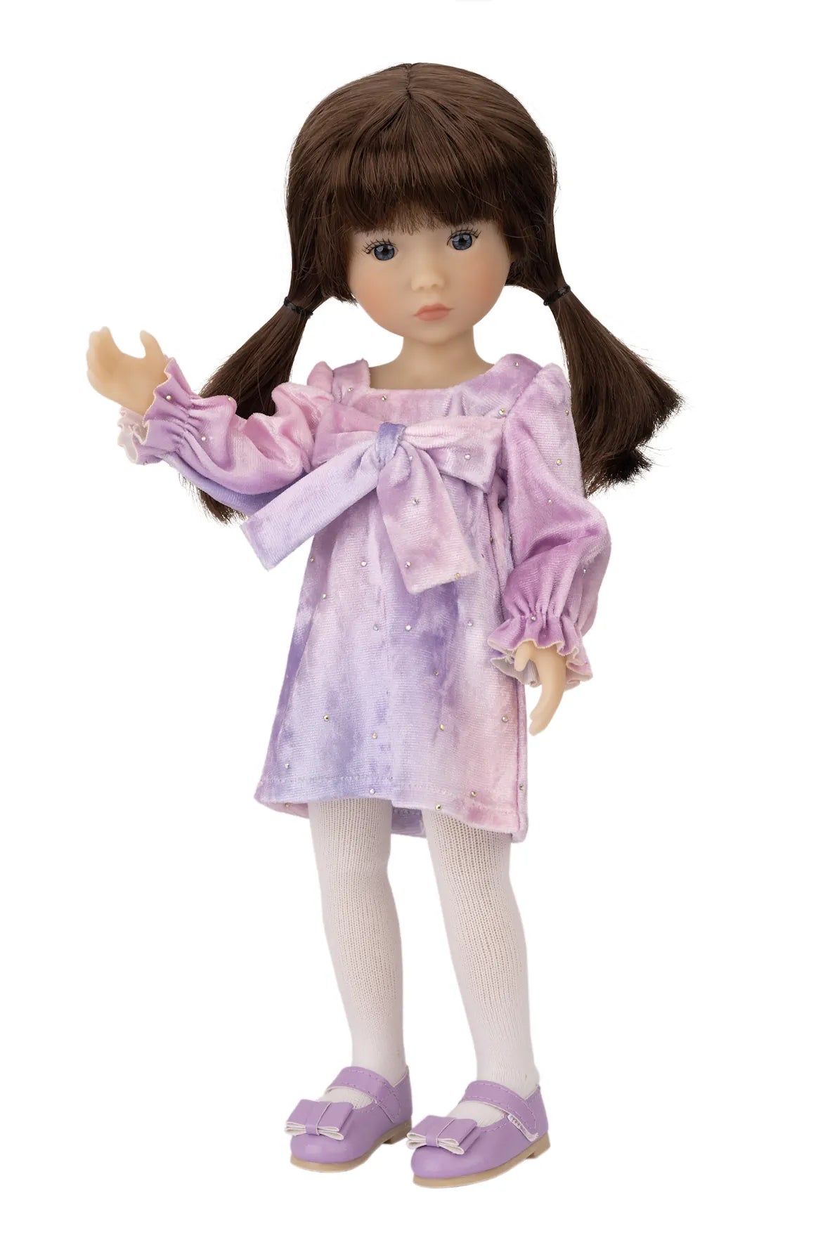 Doll wearing a purple dress with a bow on a white background