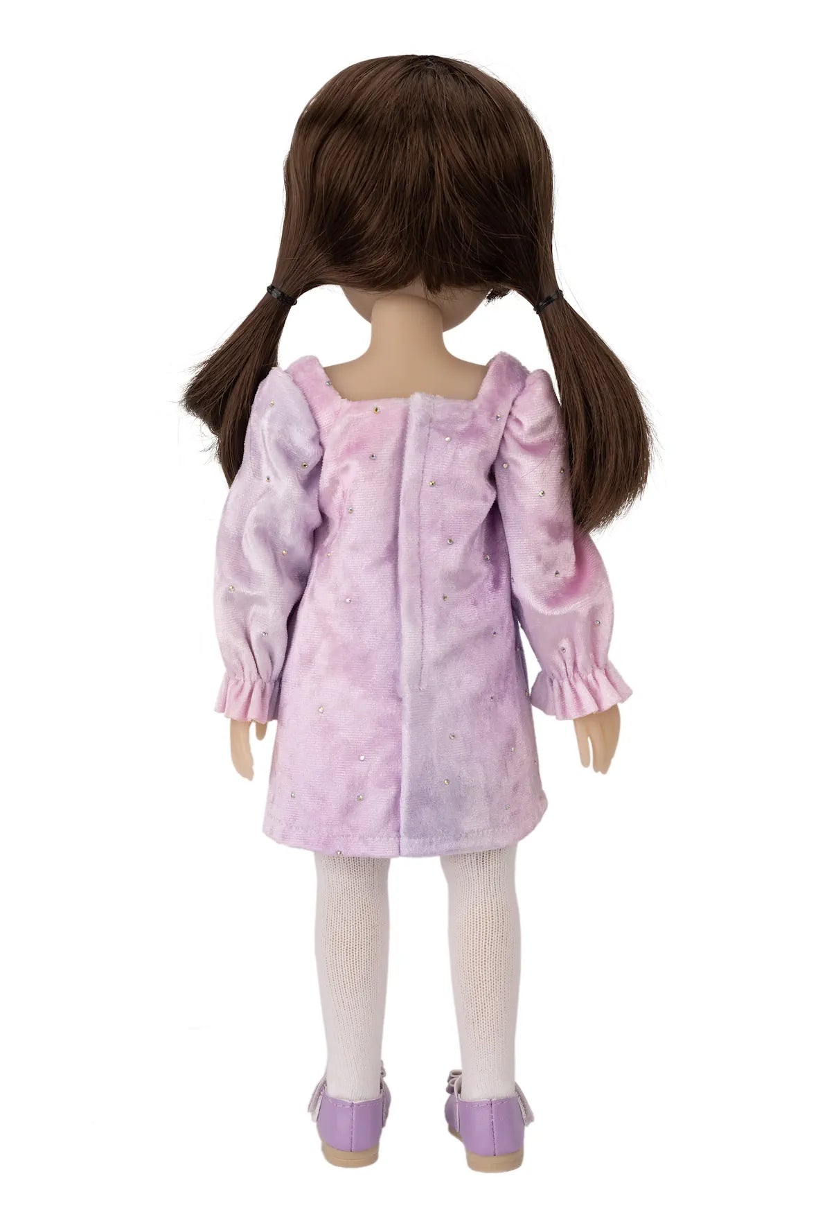Doll wearing a pink dress with puffed sleeves on a white background