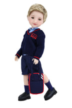 Doll wearing a navy blue school uniform with red emblem on a white background