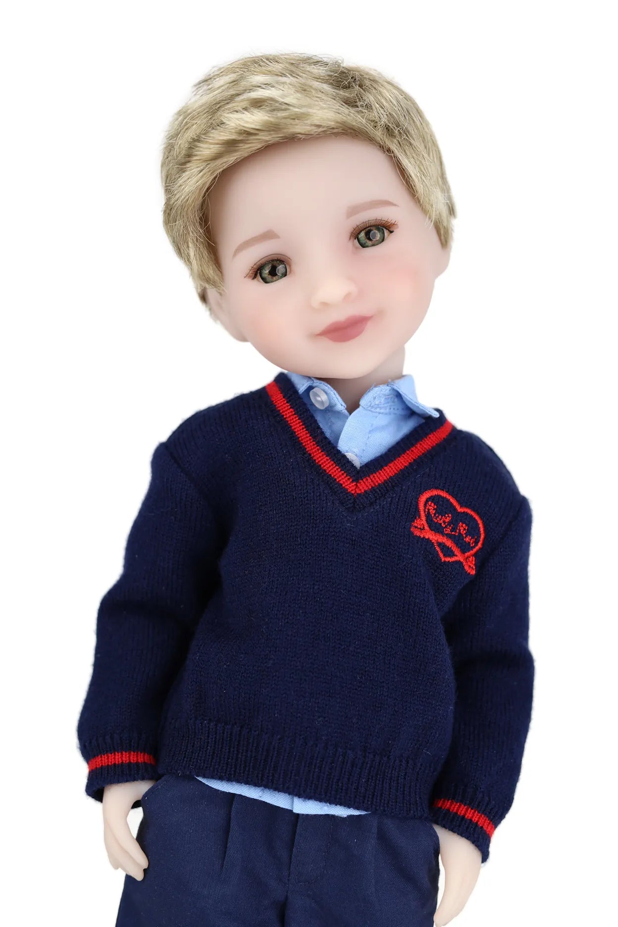 Doll wearing a navy sweater with a red emblem on a white background