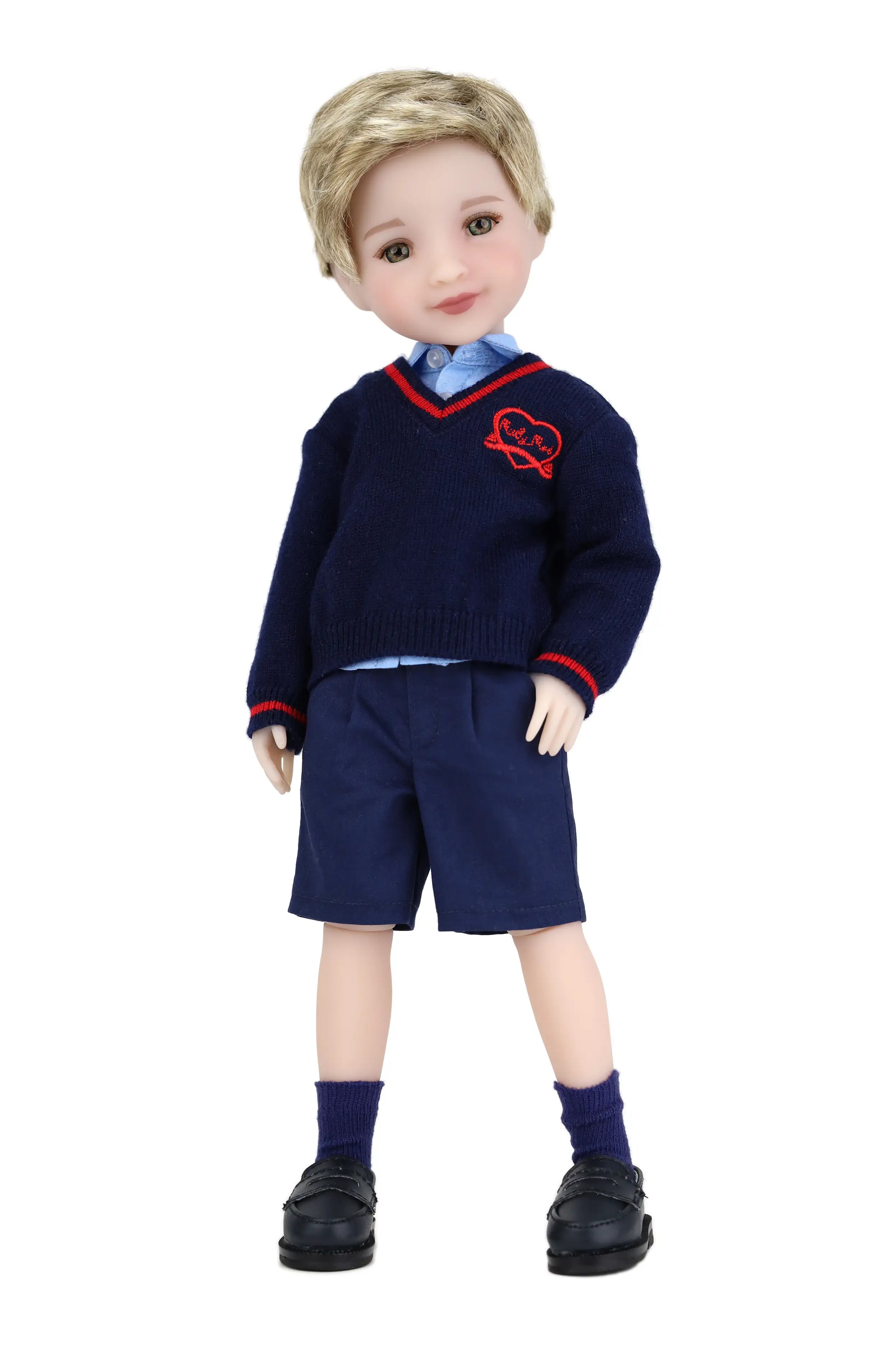 Doll wearing a navy blue school uniform with a red emblem on a white background