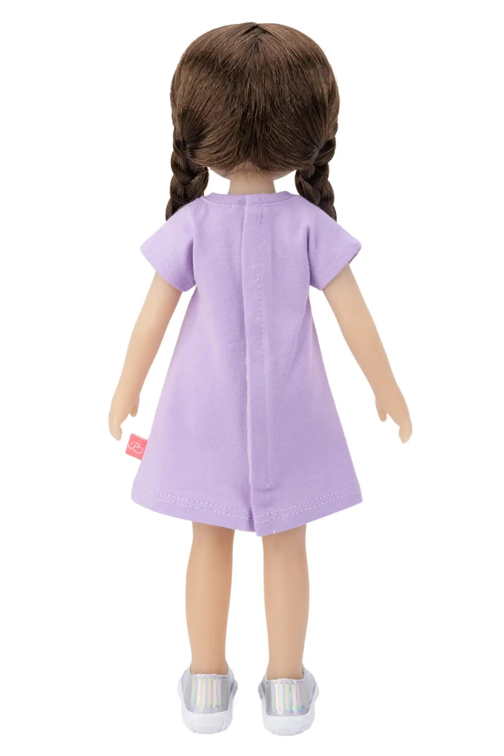 Doll wearing a purple dress on a white background