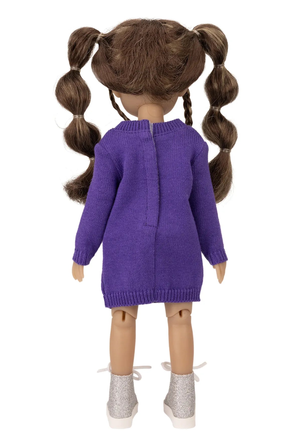 Doll wearing a purple sweater dress on a white background