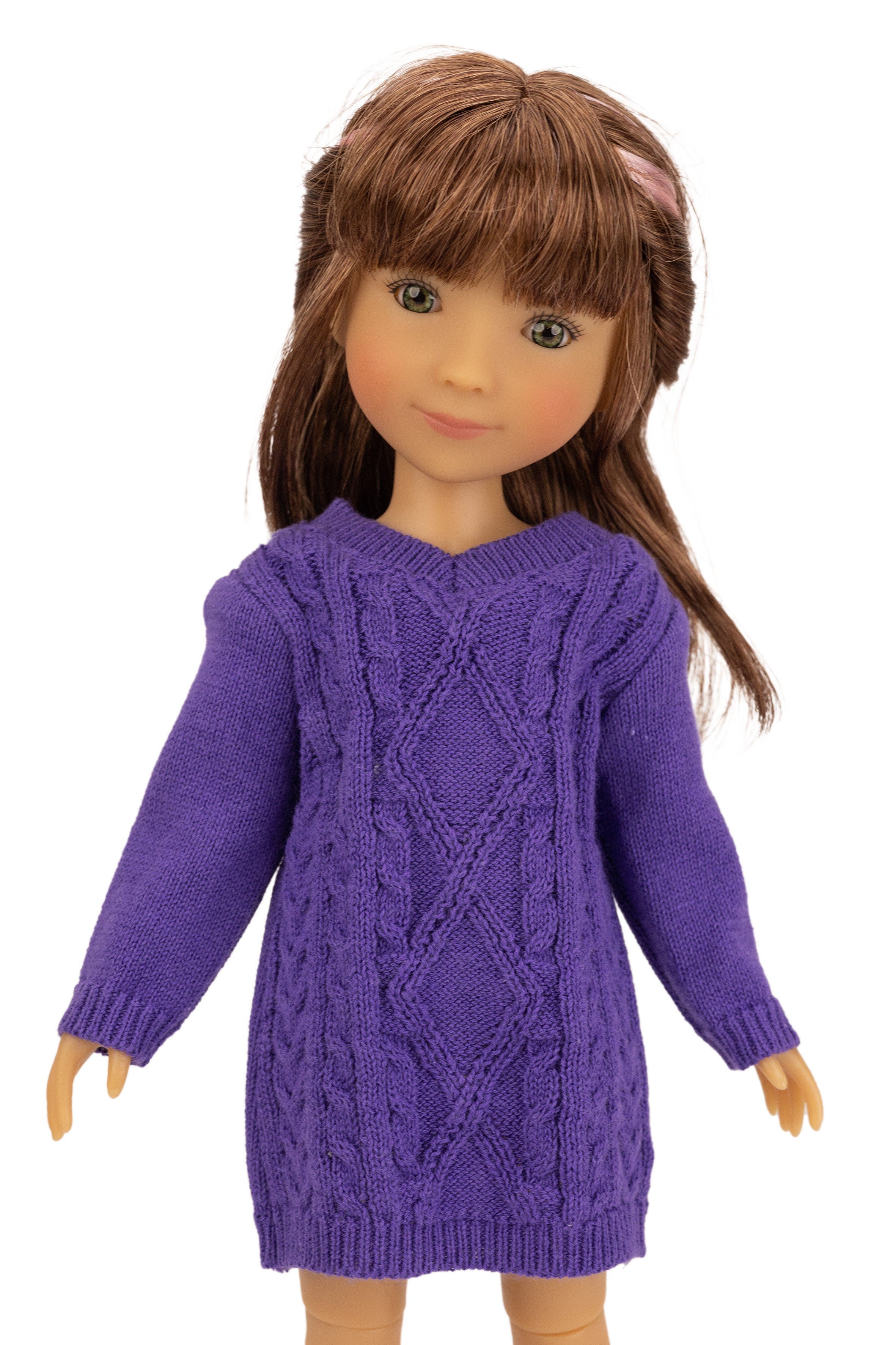 Doll wearing a purple knitted dress on a white background