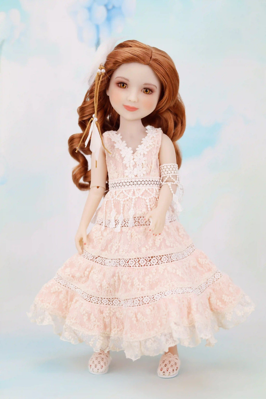 Doll wearing a white lace dress against a soft, multicolored background