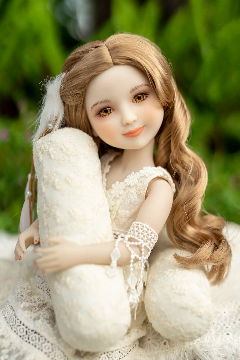 Doll with long brown hair holding a white plush toy against a blurred green background