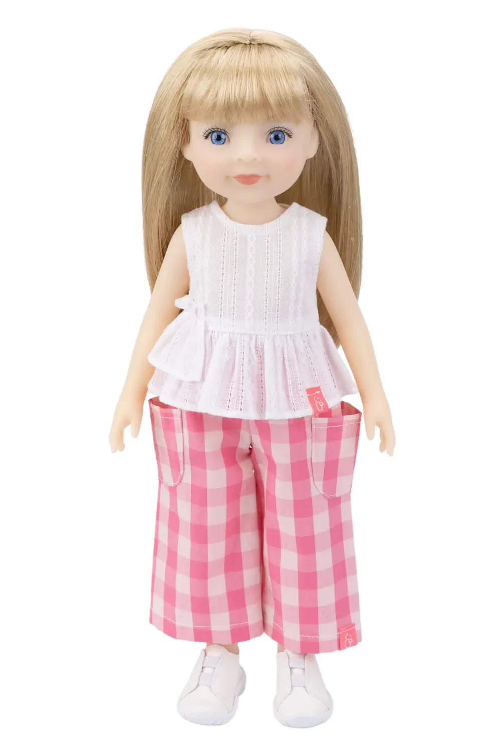 Doll wearing a white top and pink checkered pants on a white background