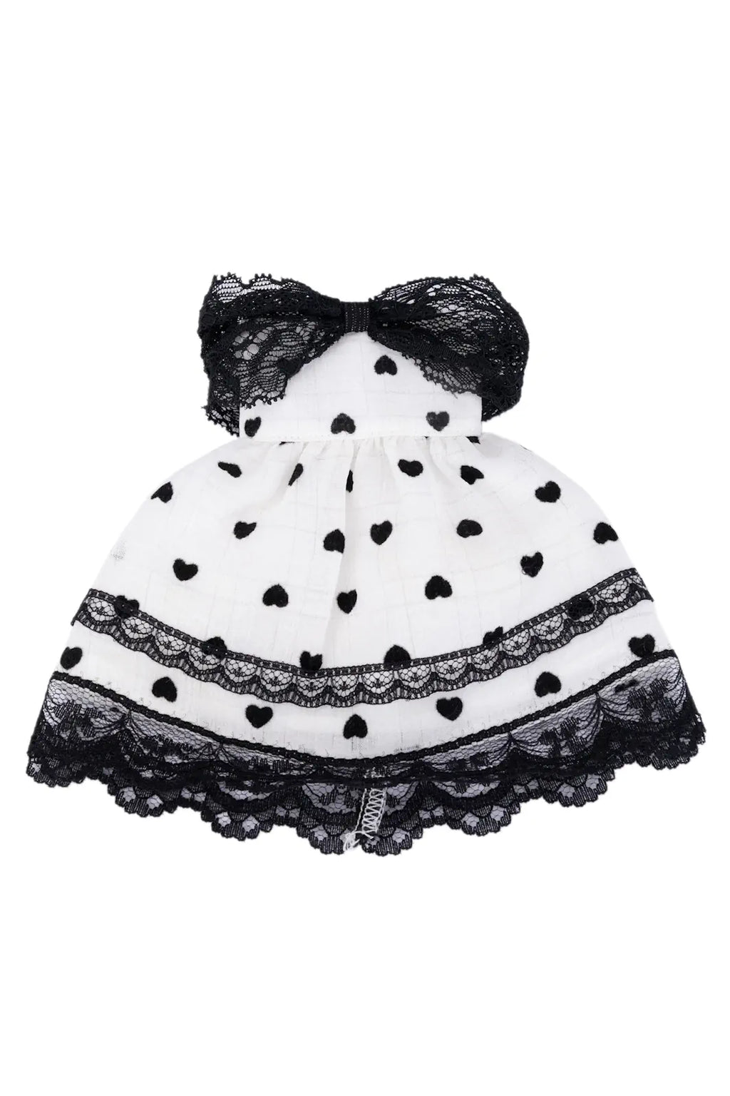 Black and white polka dot dress with a bow on a white background