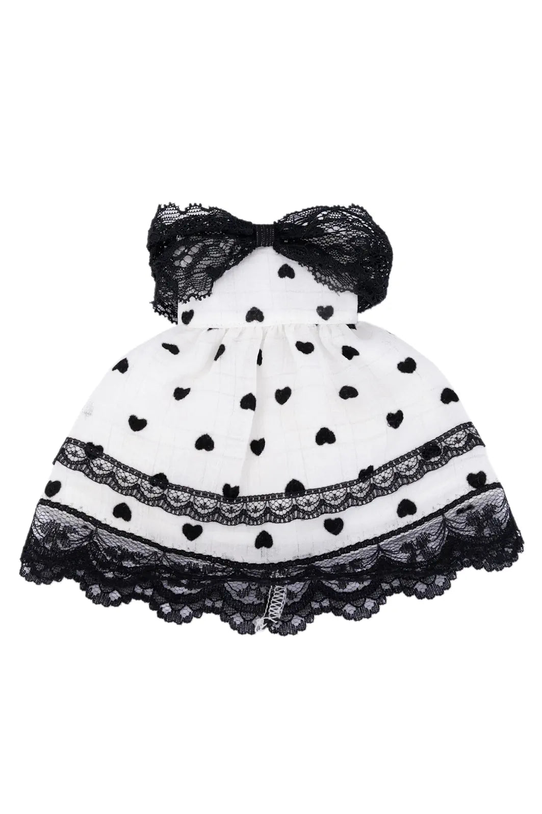 Black and white polka dot dress with a bow on a white background