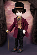 Doll in a Victorian-style outfit with a top hat and coat, holding a cane.