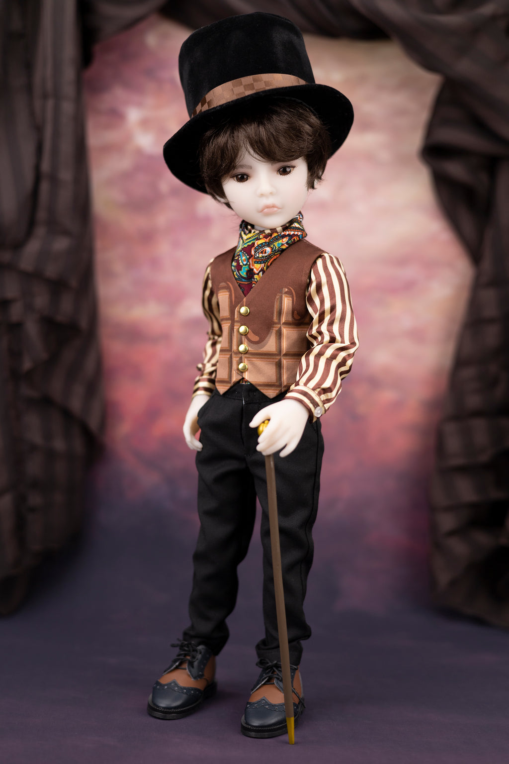 Vintage-style doll in formal attire with a top hat and cane on a textured background