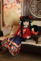 Traditional doll in a traditional Chinese outfit sitting on a wooden bench with decorative background