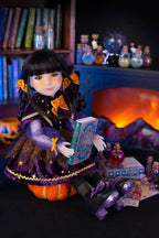 Doll in a Halloween-themed setting with books, pumpkins, and potion bottles.