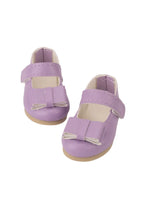 Pair of purple doll shoes with bow details on a white background